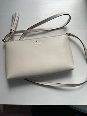 kate spade cream leather crossbody with tassel